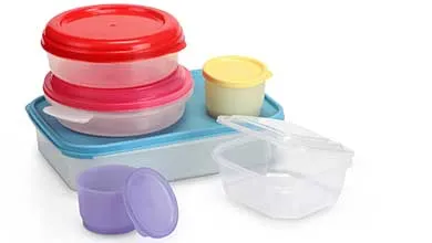 Plastic food storage containers of different shapes and sizes with red, pink, blue, yellow, and purple lids, arranged on a white background.